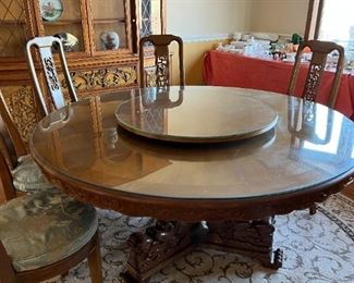 The lazy Susan is attached to the table. This table and chairs came all the way from Panama.