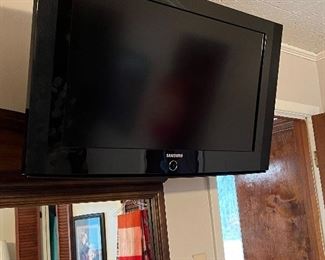 1 of 3 wall mounted TVs of various sizes