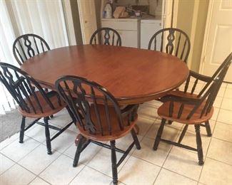 Oak Pedestal Dining/Breakfast Table with 6 Chairs and extension leaf.