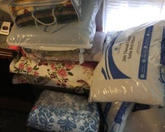 Numerous blankets and bedding