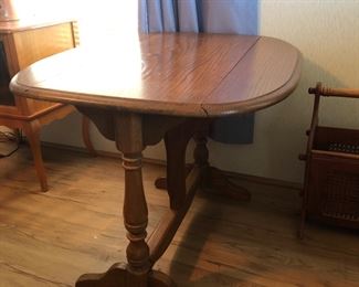 Drop leaf lamp table with the sides up.