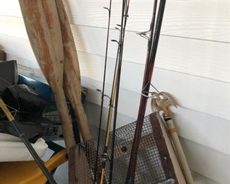 Wooden boat paddles, rods and reels, sand flea scoop