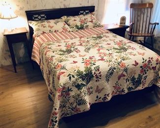 Full size bed.  Cherry headboard.  Mattress.  Quilted spread and pillow shams