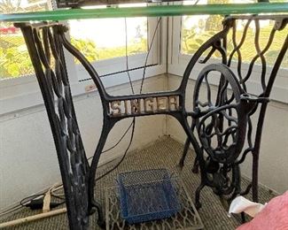 Old singer sewing machine stand used with glass table top