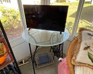 Glass table top with singer sewing machine stand