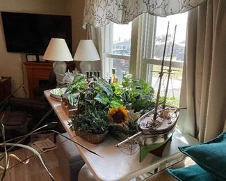 Lamps, artificial plants, large sail boat