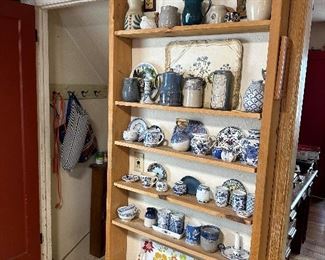 More kitchen decor, including tins, jars, porcelain and pottery.