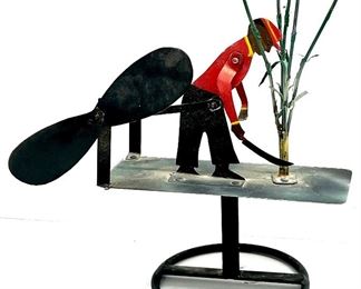 Metal folk art whirly gig 