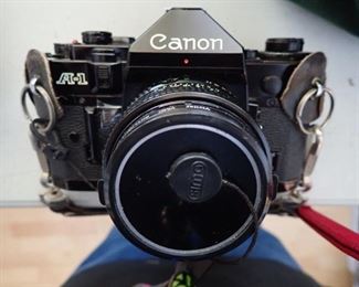 CANON A-1 FILM CAMERA WITH BAG AND EXTRA LENS - AND FILM - 