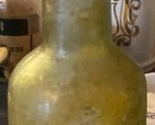 Early Embossed Druggist Bottle