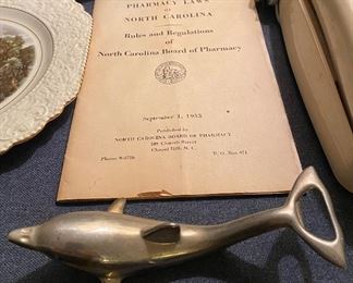 Pharmacy Laws of North Carolina/Figural Dolphin Bottle Opener