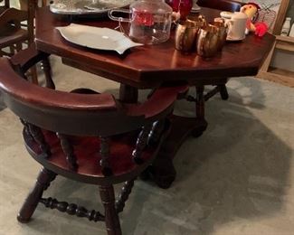 Solid wood table with swivel captain chairs 