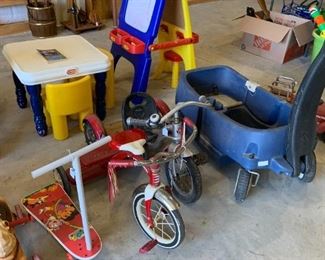 Tricycles, wagon, Little tikes table and chairs, art easel