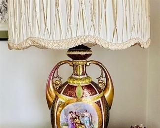 Royal Vienna style porcelain lamp in the form of an urn.  Hand made pleated silk shade.