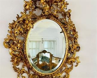 Rococo style oval gilt mirror