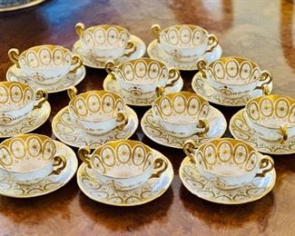 Royal Cauldon (England) gold encrusted cream soup bowls and saucers.  Set of 12.