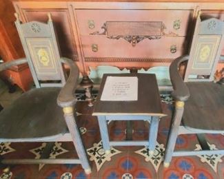 3 piece sitting arrangement, table between 2 chairs.  c 1920. Rubbed blue steel color with gold leaf embellishments. Originally from Spain, but found in Hollywood. Were once in a 1920's Hollywood film with John Barrymore.