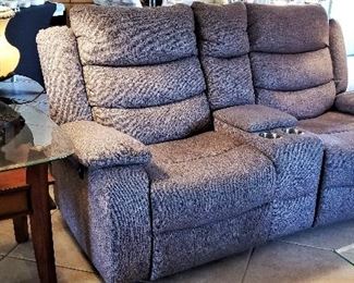 Reclining electric sofa/ 2 seater, wall hugger with cup holders. Reclines all the way back. Gray