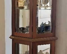 Tall narrow lighted curio cabinet