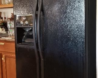Black side-by-side refrigerator and freezer