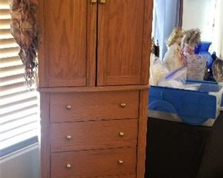 Tall jewelry armoire that spins to reveal a full length mirror.