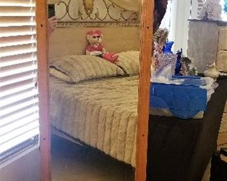 Tall jewelry armoire that spins to reveal a full-length mirror.