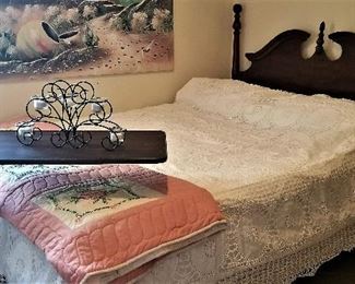 Queen bed with queen mattress. Adjustable bed tray. Brand new white crocheted bedspread. Embroidered quilt.