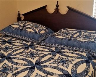 Another queen bed and blue and white wedding ring quilt
