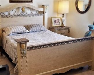 Neutral bedroom set with electric sleep number king bed, 2 matching bedside dressers, tall bureau, and wide dresser with mirror. 