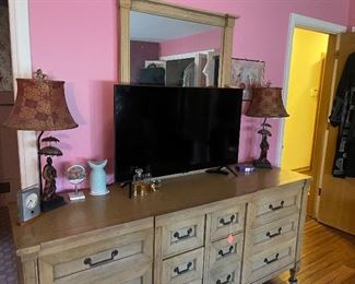 Lamps, dresser with mirror, flatscreen, smart TV