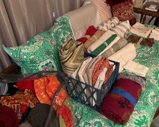 Daybed, assorted fabrics, curtains, sewing machine, embroidery machine, fabric mat, ironing board