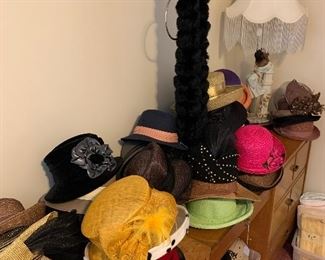 Dressers, many hats of all styles, lamps