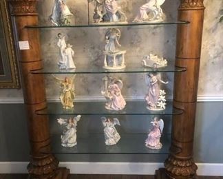 We have a matched pair of these wonderful Corinthian column glass displays. Simply grand!