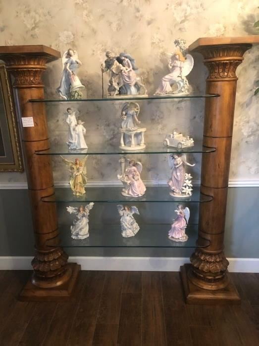 We have a matched pair of these wonderful Corinthian column glass displays. Simply grand!