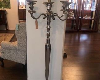 There are a pair of these floor standing candelabras