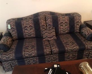 Striped 2-cushion sofa w/ kick-pleat skirt