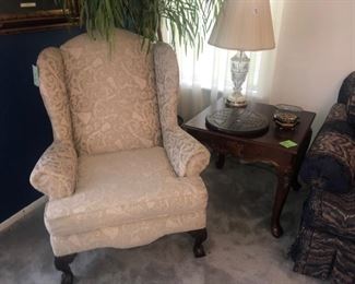 There are a pair of these gorgeous claw-foot wing chairs