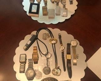 Selection of wristwatches and lighters