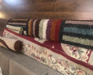Numerous rugs in various styles and sizes