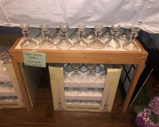 Dozens of tapered glass candle holders