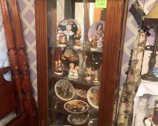And we have still another curio display cabinet w/ side entry doors