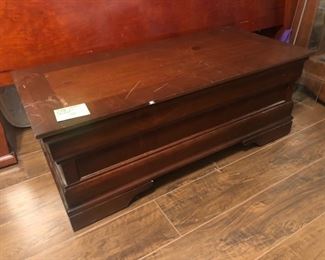 A lowboy cedar chest with a false bottom