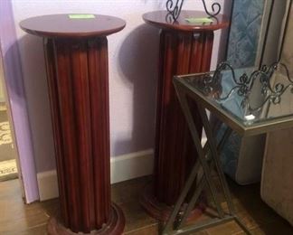 A pair of wooden column pedestals