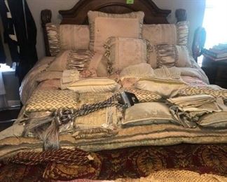 Can't see this beautiful bed for all the pillows and bedding!
