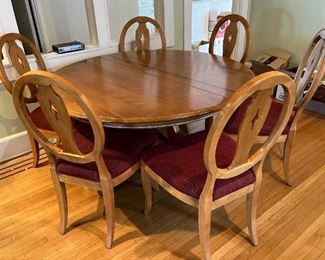 Ethan Allen "Country Colors" maple dining set.  54" round table with 1 - 22" leaf and 6 matching chairs