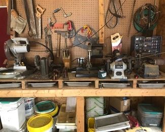 Work bench full of tools
Compound miter saw
Grinder 