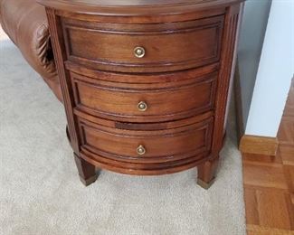 Curved front end table with 3 drawers, flat back
