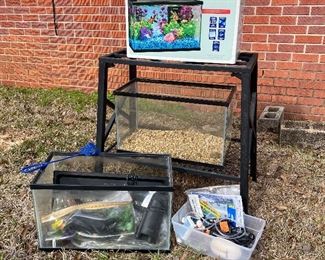 Aquarium stand, three aquariums, and supplies. 