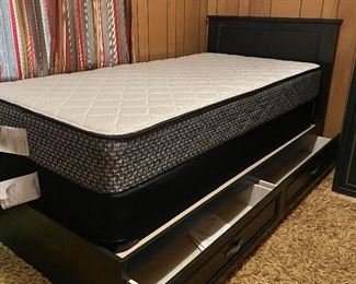 Twin size bed with storage drawers in platform. Mattress and box springs are new. Platform can be used without box springs. 