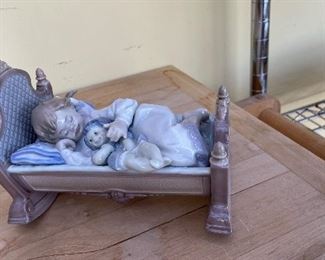 Lladros. "Girl in Crib with Doll." #5171.
